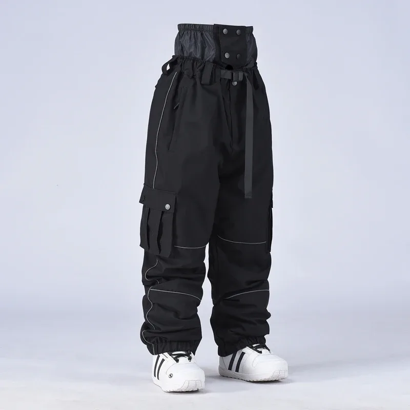 Unisex baggy snowboard pants in Black — baggy fit with cargo pockets and reflective trim, worn by a model