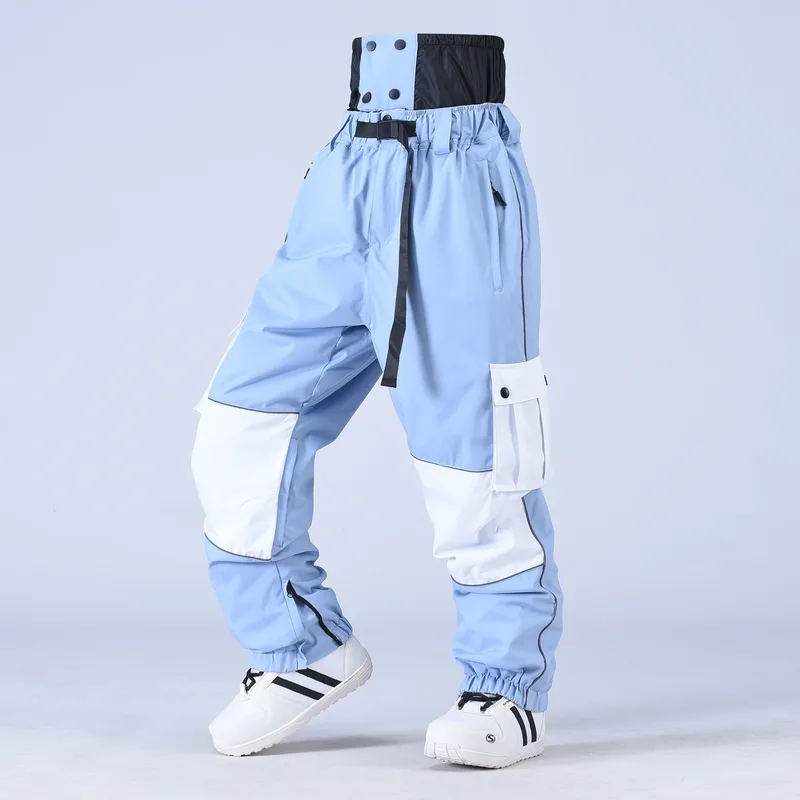 Unisex baggy snowboard pants in Light Blue — baggy fit with cargo pockets and reflective trim, worn by a model