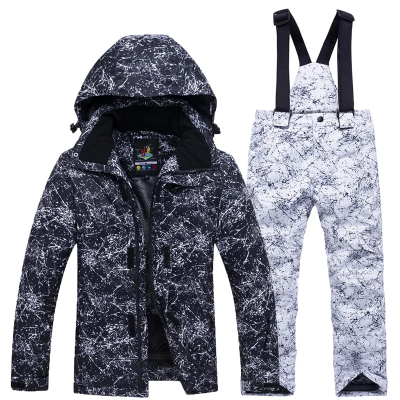 Girls' black ink-splatter print ski jacket with white print bib pants