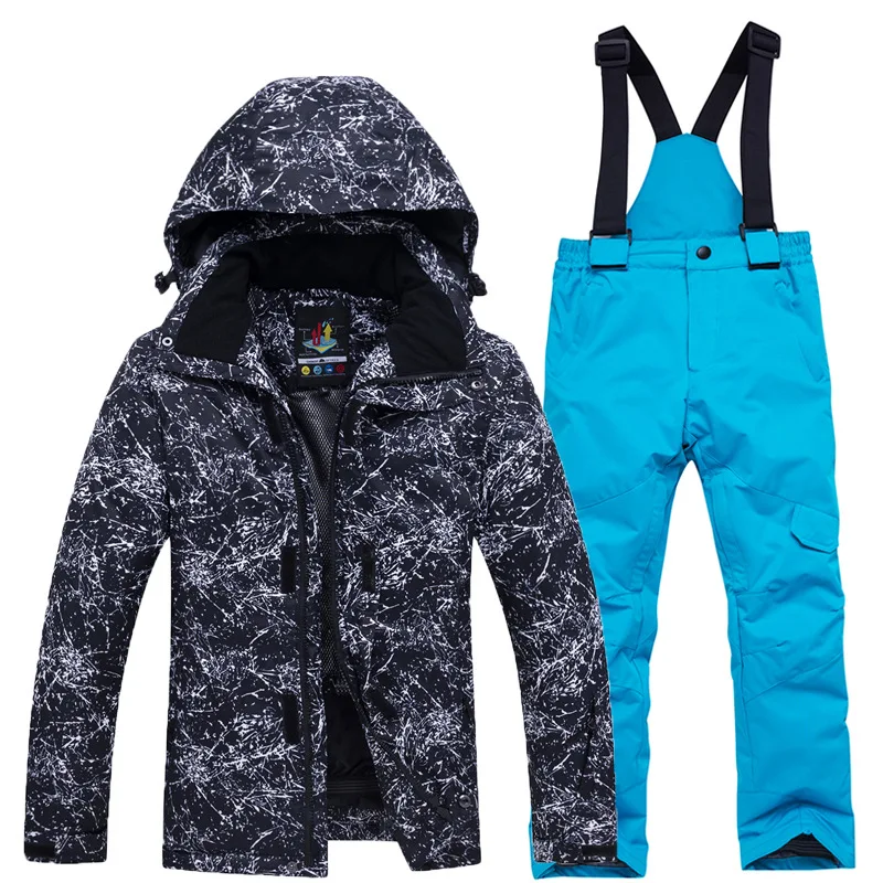 Girls' black ink-splatter print ski jacket with turquoise bib pants