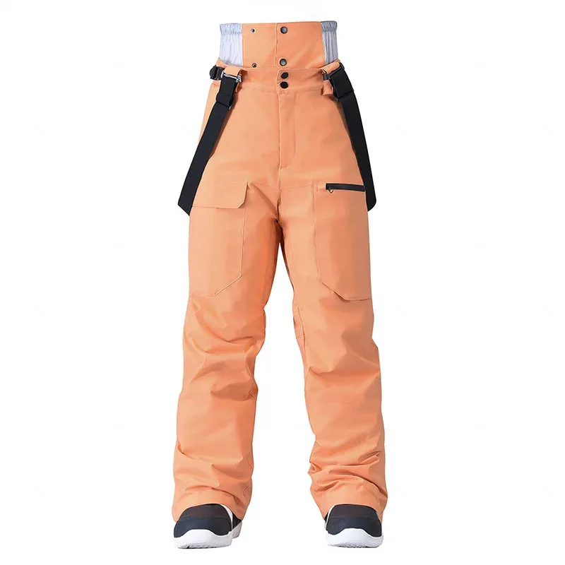 Unisex insulated bib pants in Orange — high bib front and cargo pockets, flat lay