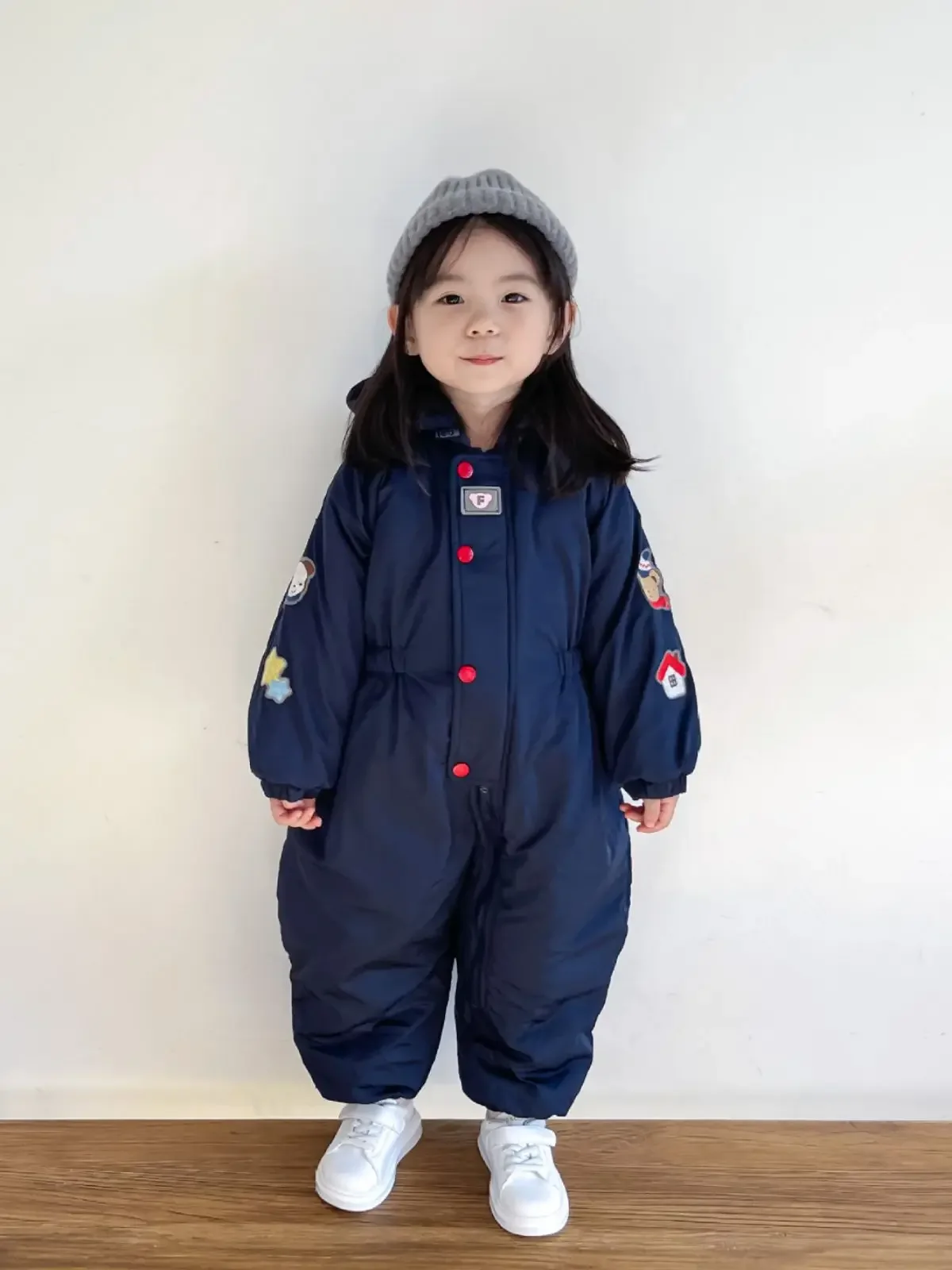 Kids' cotton-padded cartoon one-piece ski suit — Navy, on model, standing