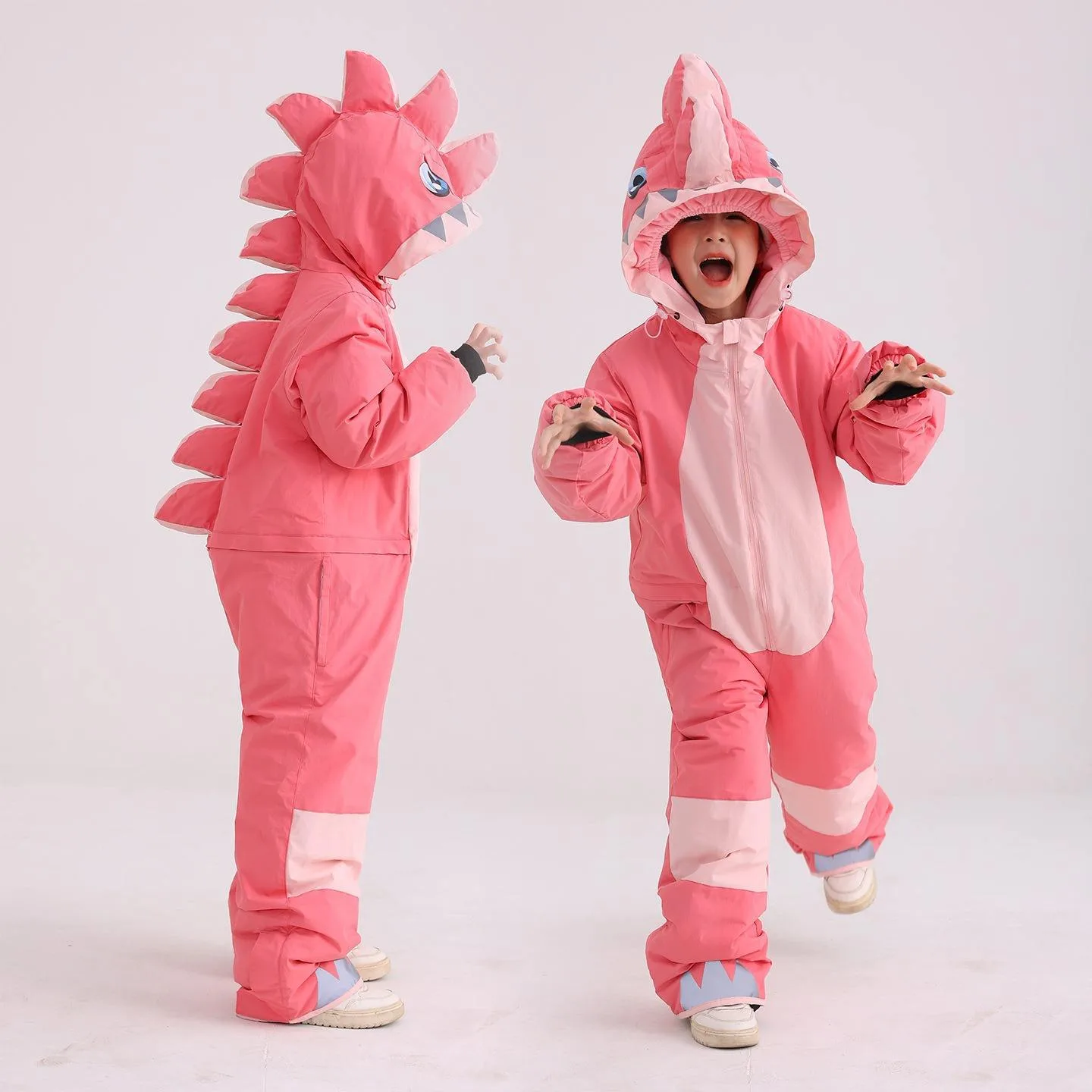 Kids' dinosaur one-piece ski suit — Pink, back and front
