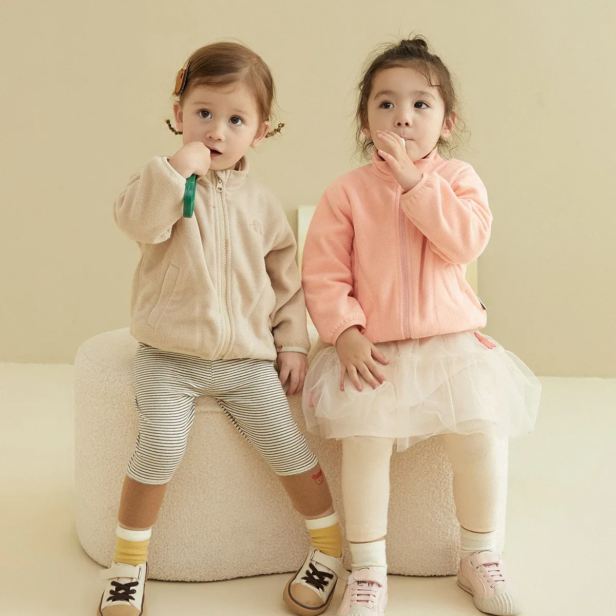 Kids' Melange Fleece Jacket — Creamy Almond & Pearl Pink, worn
