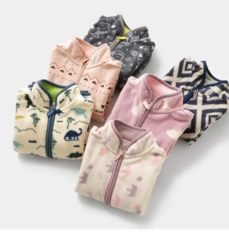 Kids' Printed Polar Fleece Zip Jacket — 7 Prints — Seven prints, folded stack