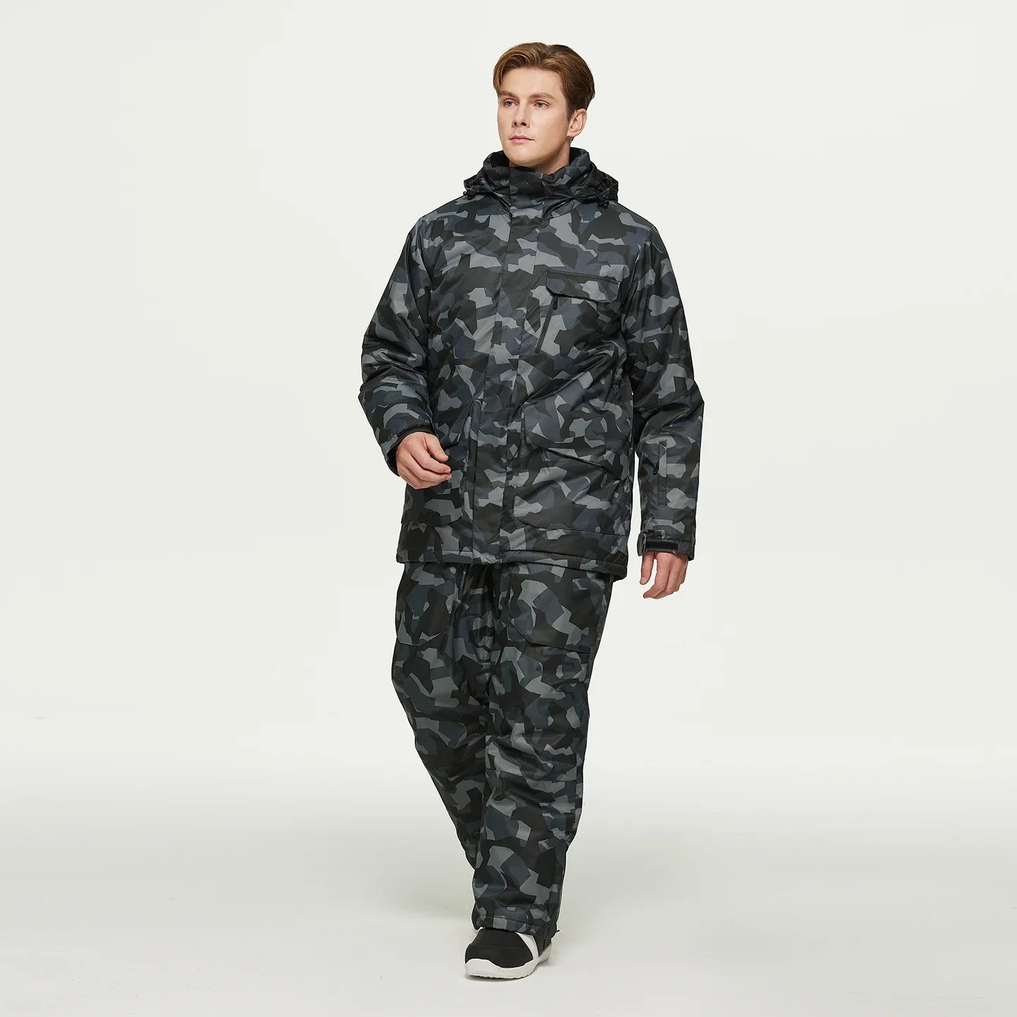 Men's camo ski set — dark grey camo — insulated jacket and bib pants on a model