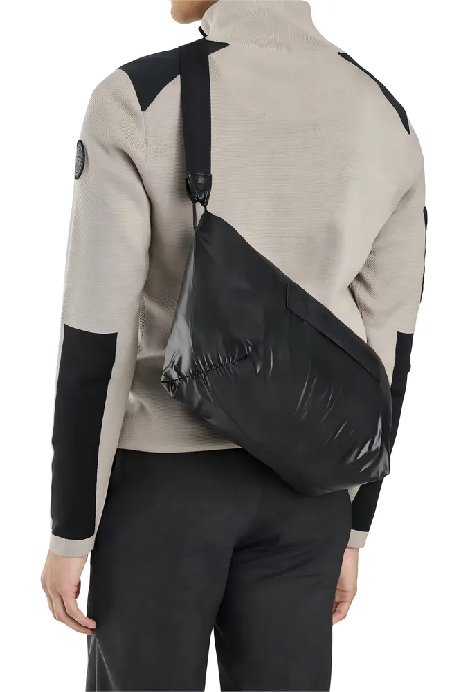 Men’s Duck Down Jacket — Black — Black, packed in its carry pouch, worn cross-body