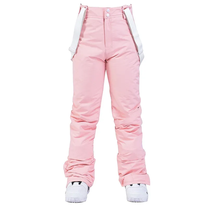 Unisex ski bib pants in Pink — adjustable suspenders and a straight leg, flat lay