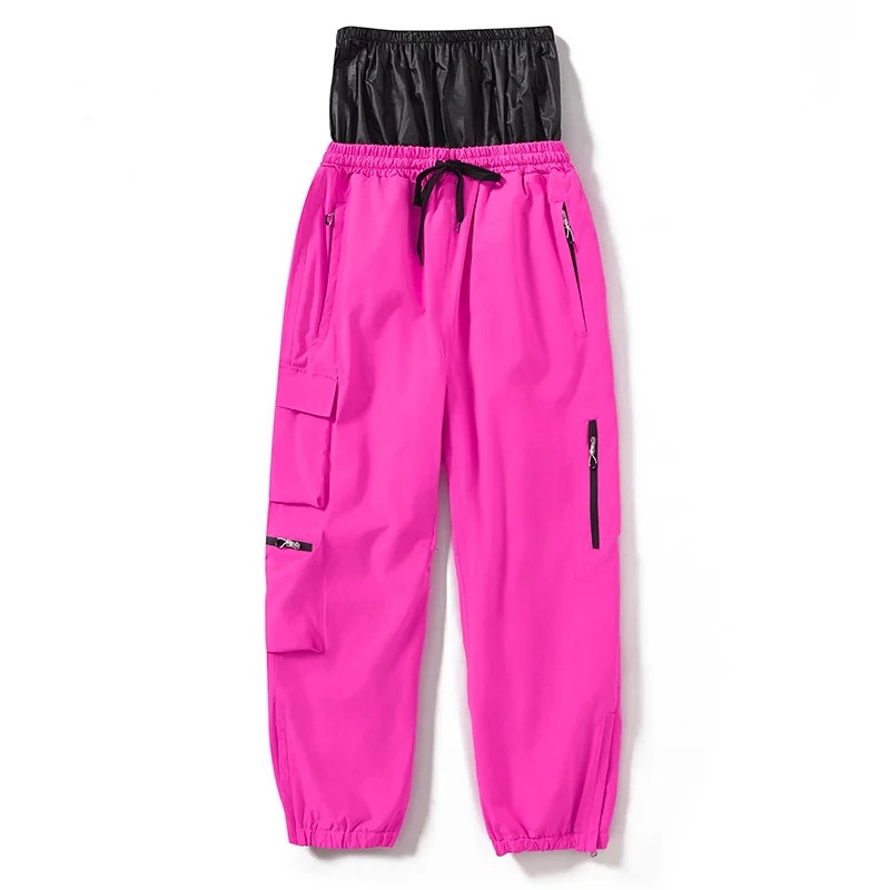 Adults’ insulated ski pants in Rose Red — relaxed fit with cargo pockets and an elastic drawcord waist, flat lay