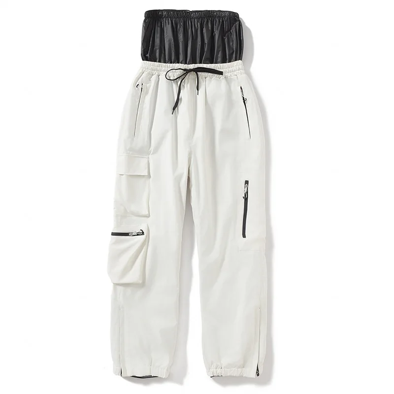 Adults’ insulated ski pants in White — relaxed fit with cargo pockets and an elastic drawcord waist, flat lay