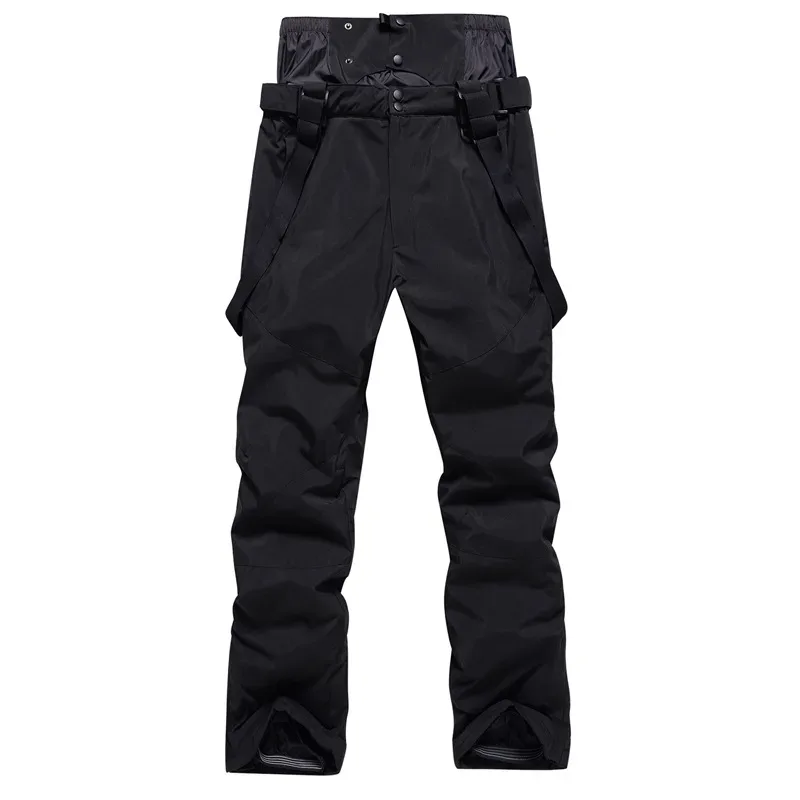 Unisex ski bib pants in Black — adjustable suspenders and a relaxed leg, flat lay