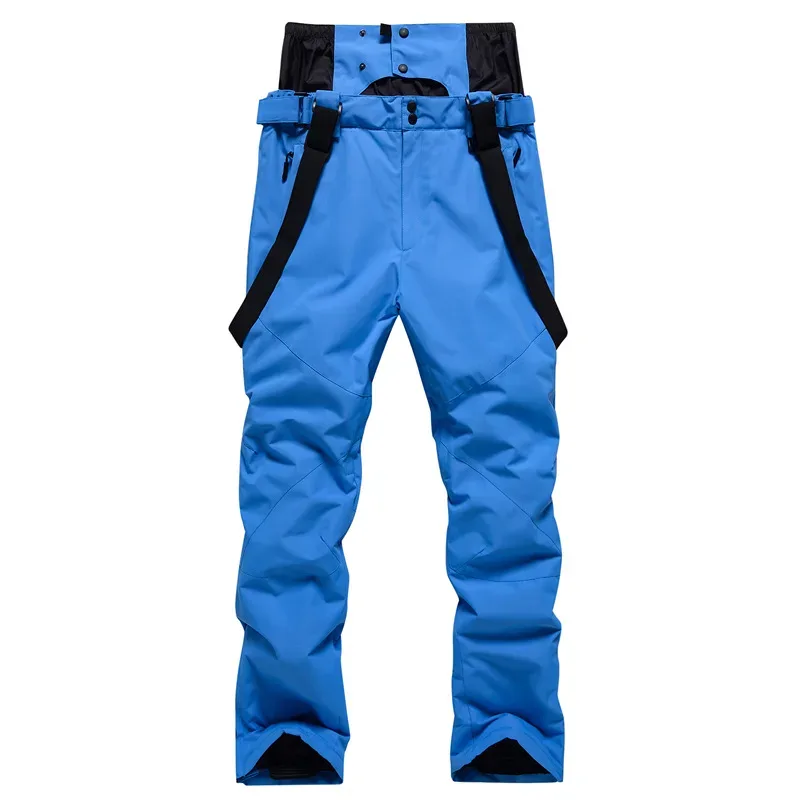 Unisex ski bib pants in Blue — adjustable suspenders and a relaxed leg, flat lay