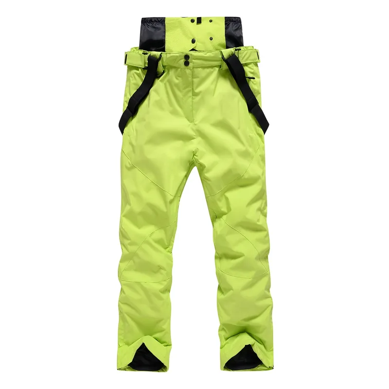Unisex ski bib pants in Fruit Green — adjustable suspenders and a relaxed leg, flat lay