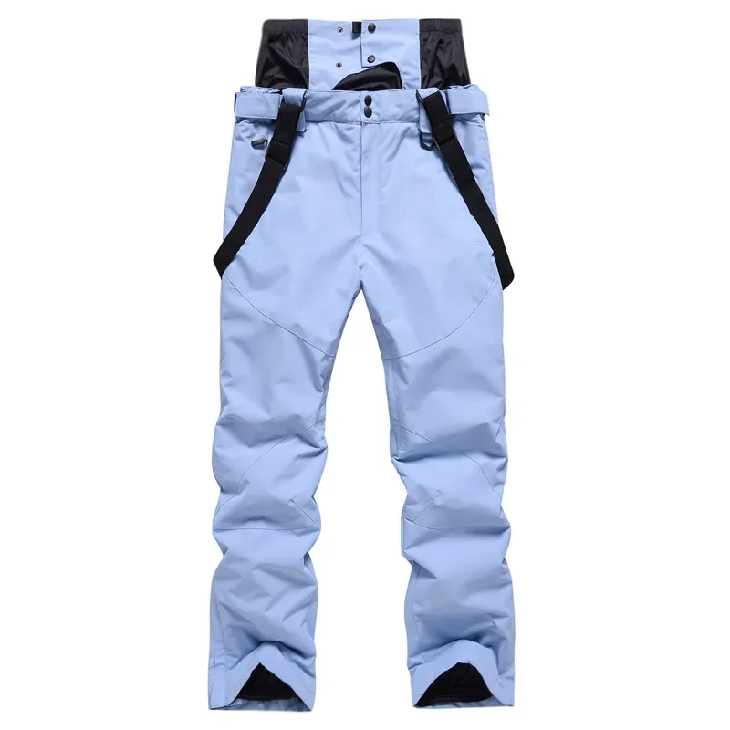 Unisex ski bib pants in Light Blue — adjustable suspenders and a relaxed leg, flat lay