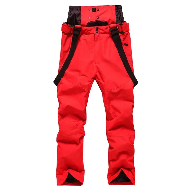 Unisex ski bib pants in Red — adjustable suspenders and a relaxed leg, flat lay