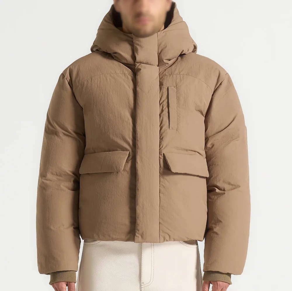 Unisex Hooded Puffer Jacket — Taupe & Black — Taupe, front view, worn