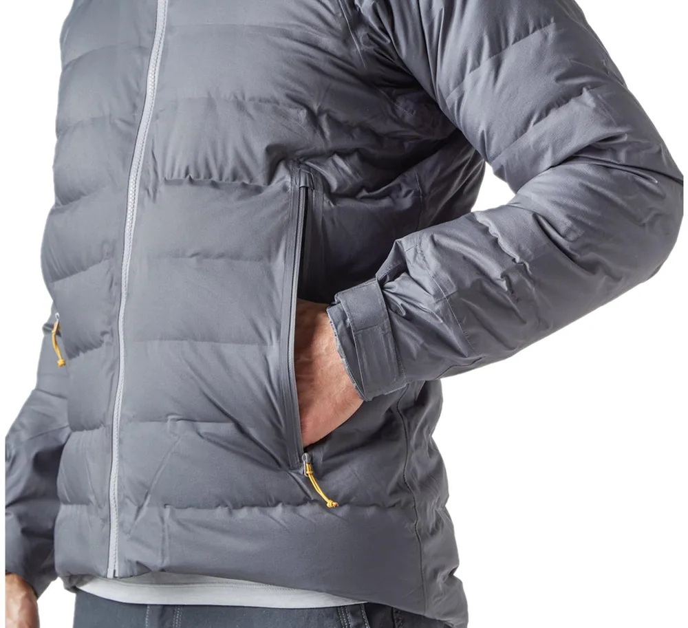 Unisex Packable Puffer Jacket — Grey — Grey, pocket and cuff close-up, worn