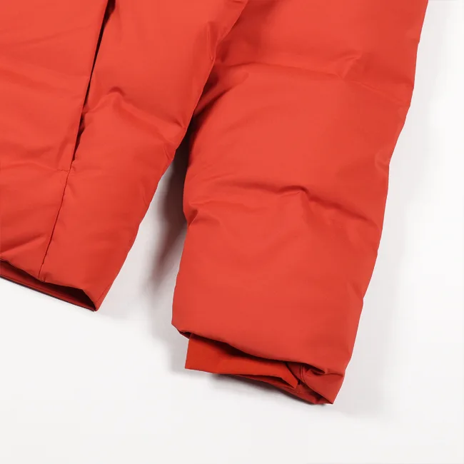 Unisex Quilted Jacket — Rust Orange — Rust Orange, cuff detail