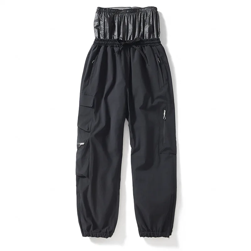 Unisex insulated ski pants in Black — relaxed fit with cargo pockets and an elastic drawcord waist, flat lay