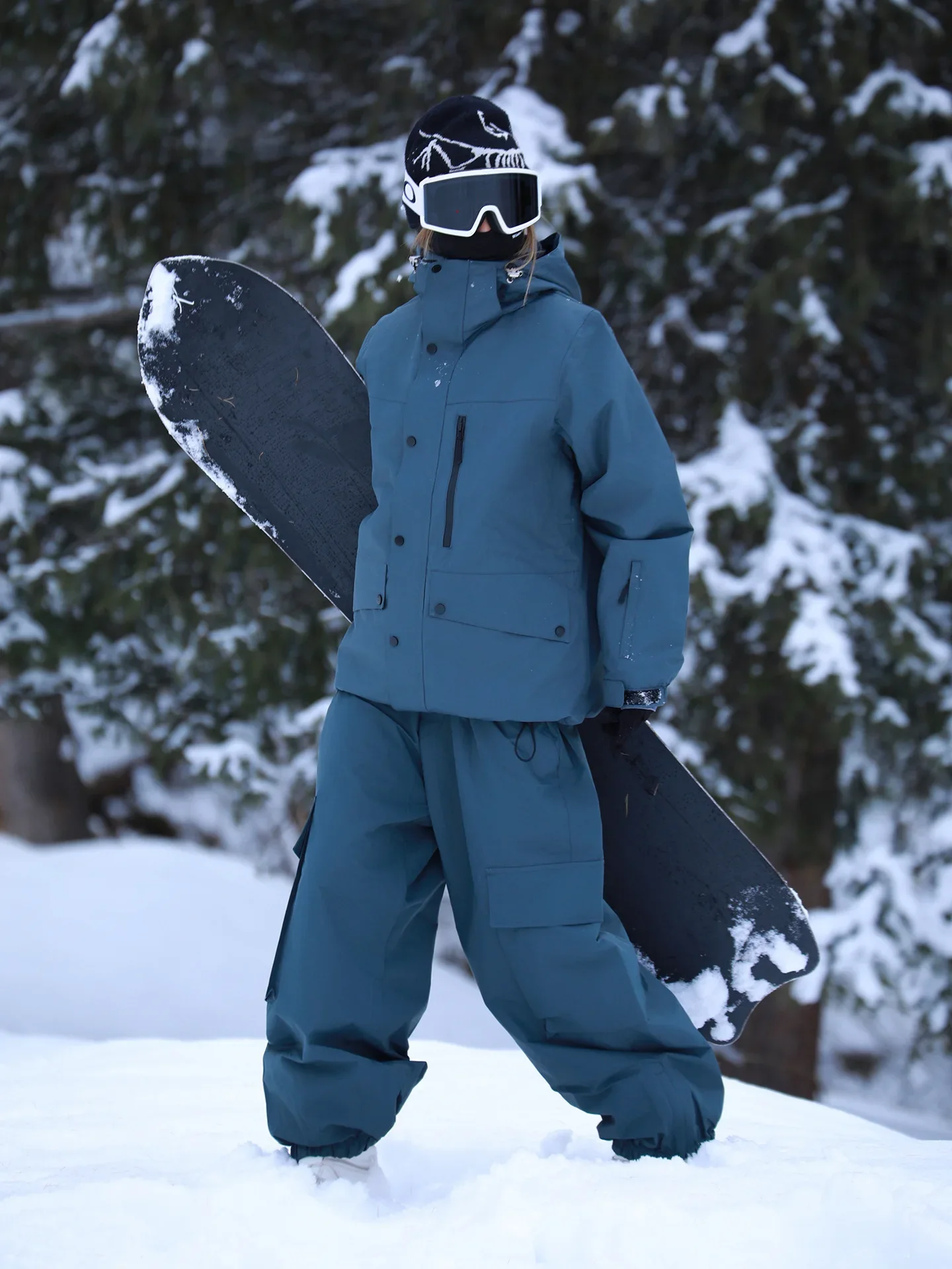 Unisex ski set in Steel Grey — insulated jacket and snow pants worn on the snow