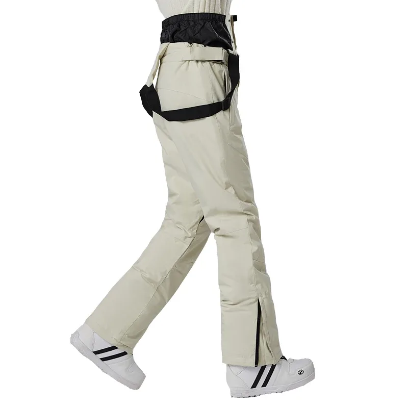 Unisex insulated ski pants in Beige — regular waist and a clean leg, worn by a model