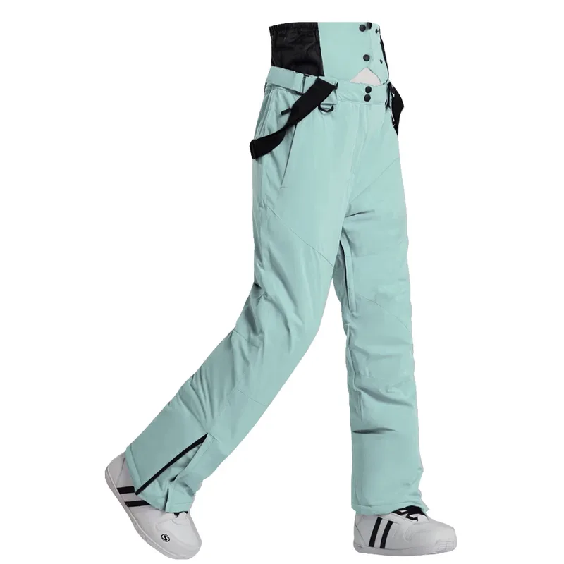 Unisex insulated ski pants in Light Green — regular waist and a clean leg, worn by a model