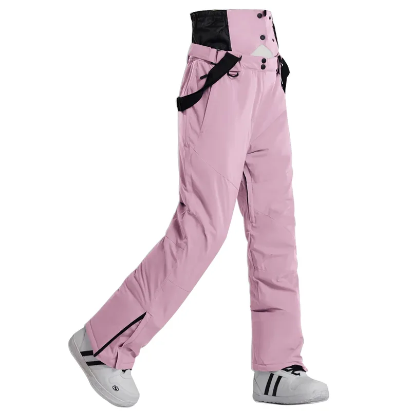 Unisex insulated ski pants in Pink — regular waist and a clean leg, worn by a model
