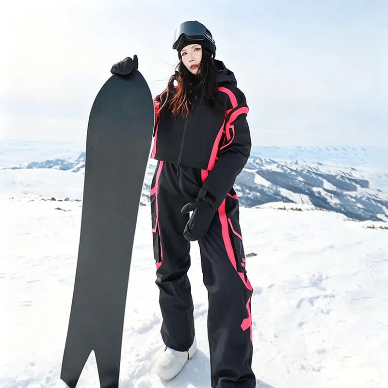 Unisex Two-Piece Ski Set with Bib Pants — 4 Colourways — Black & Pink, worn on snow with snowboard