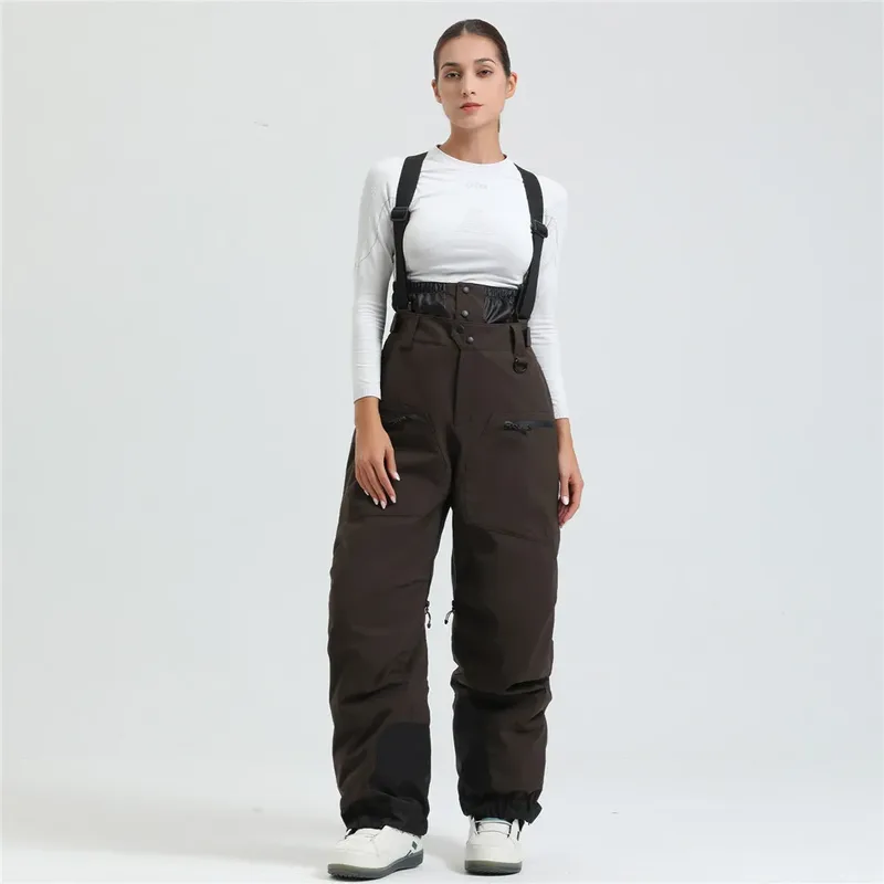 Women's ski bib pants in Brown — adjustable suspenders and a shaped fit, worn by a model