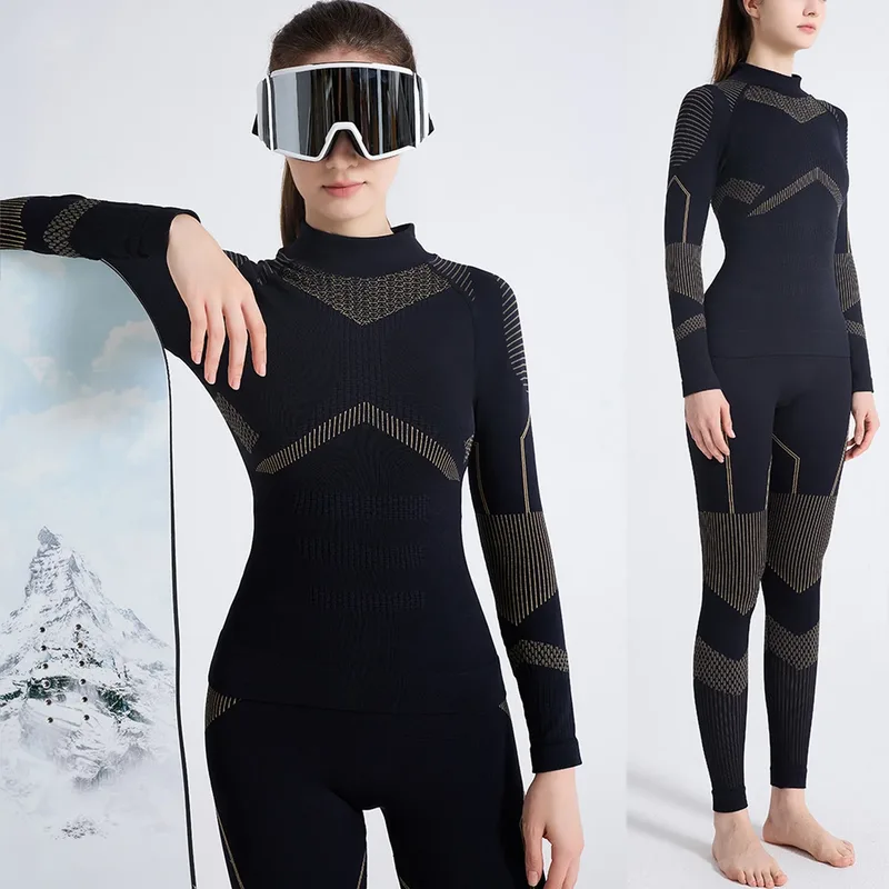 Women's Seamless Base Layer Set — 2 Colourways — Black, seated on snow