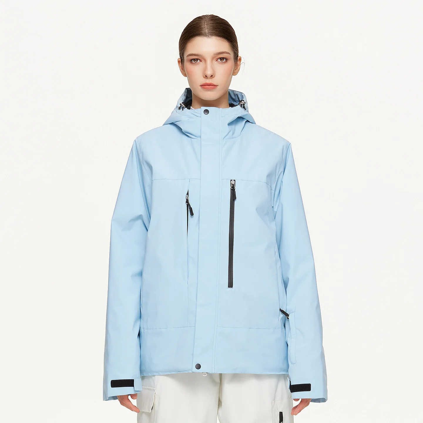 Woman wearing the women’s insulated ski jacket in Light Blue with PP cotton fill and an attached hood