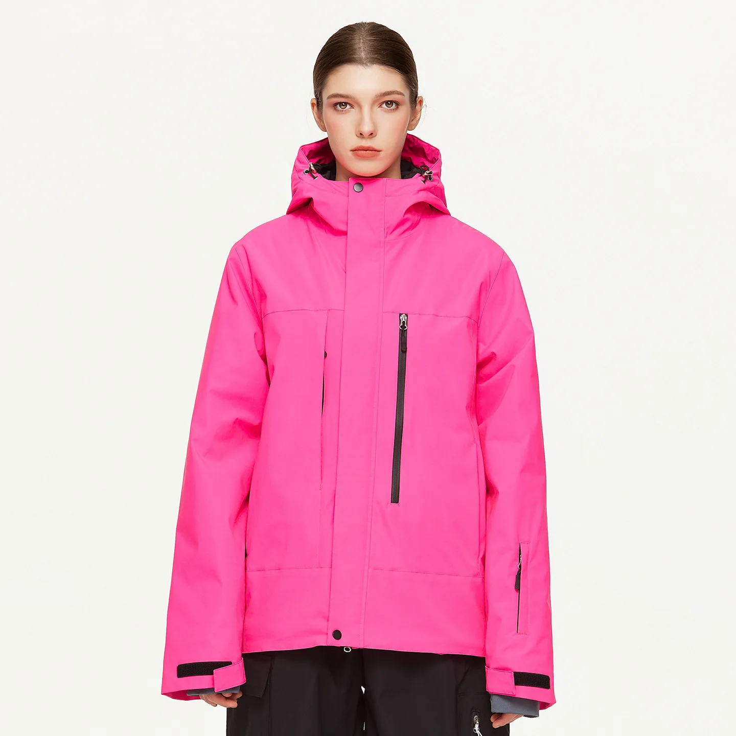 Woman wearing the women’s insulated ski jacket in Rose Red with PP cotton fill and an attached hood
