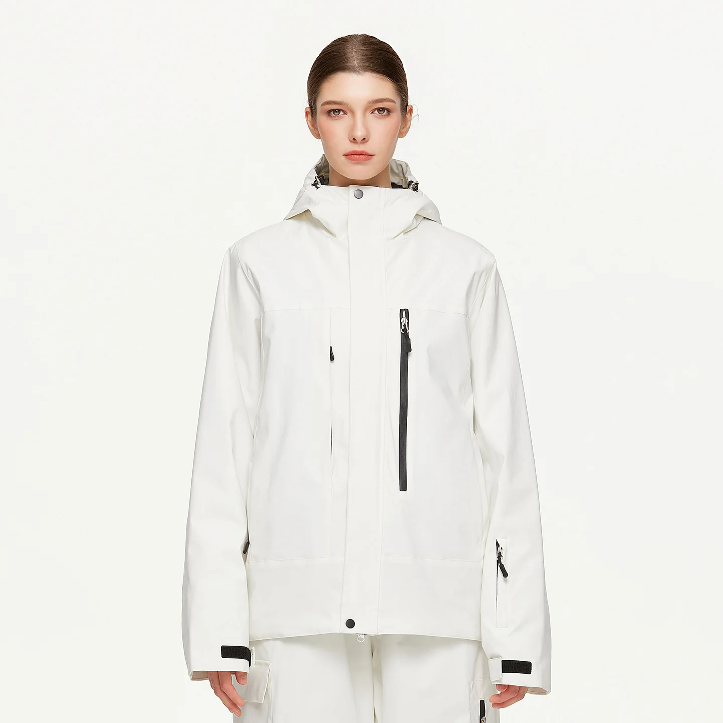Woman wearing the women’s insulated ski jacket in White with PP cotton fill and an attached hood
